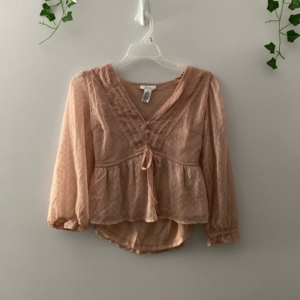 Woman’s pink blouse